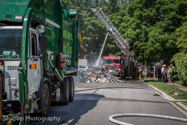 Buffalo Grove FD douses a garbage fire from the contents of a garbage truck on Logsdon Lane 7-8-14 Larry Shapiro photographer shapirophotography.net